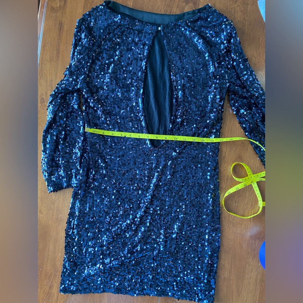 Black sequin long sleeve mini dress with back cutout